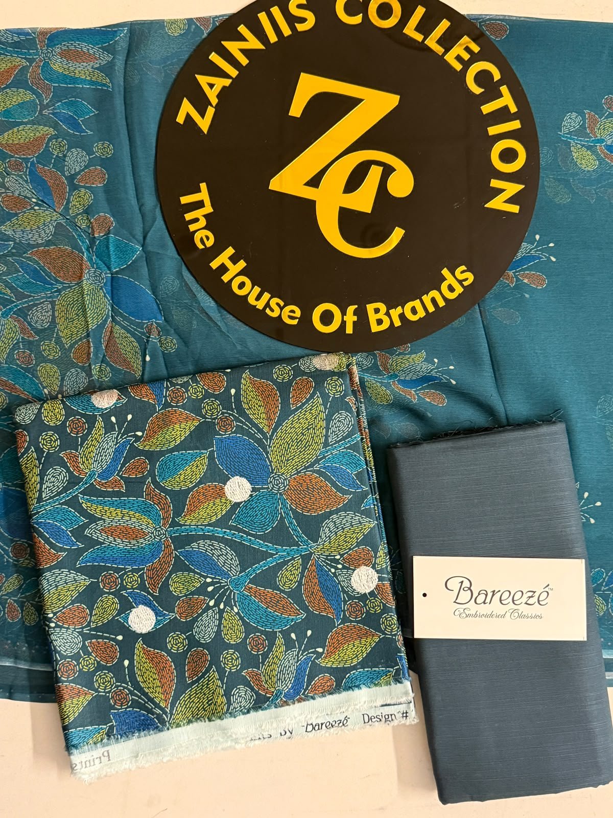 WhatsApp Image 2026-10-09 at 3.49.03 PM (1) Bareeze Teal Blue Floral Printed 3-Piece Unstitched Suit with Matching Trouser - Image 1