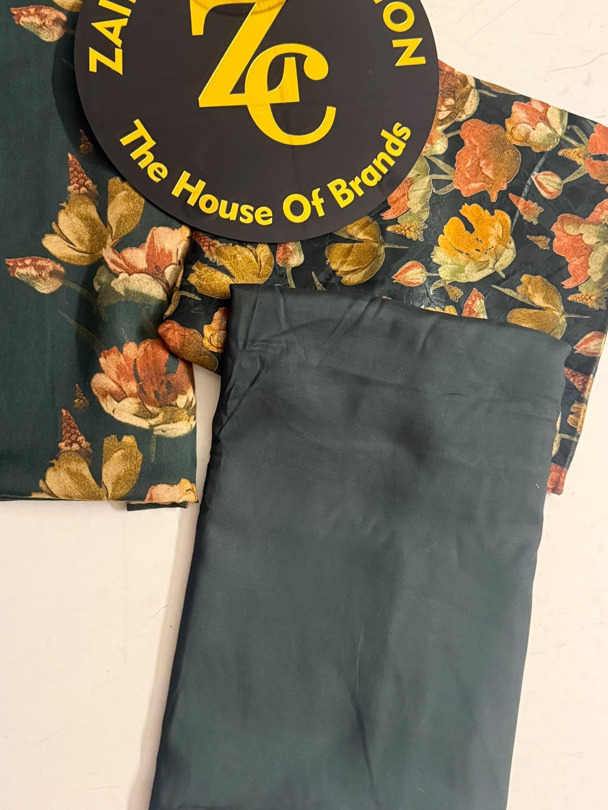 WhatsApp Image 2026-10-09 at 5.35.11 PM (1) Dark Green Floral Printed 3-Piece Unstitched Suit with Matching Trouser - Image 1