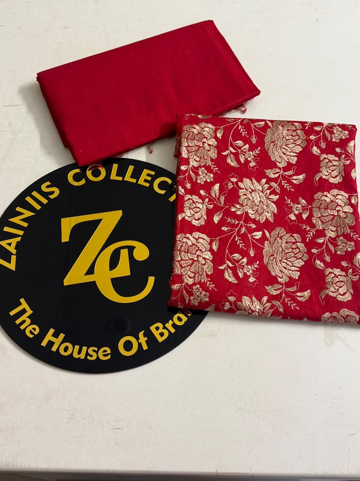 WhatsApp Image 2026-10-12 at 4.20.25 PM (2) Bareeza Red Embroidered 2 Piece Lawn Suit – Gold Floral Design - Image 1