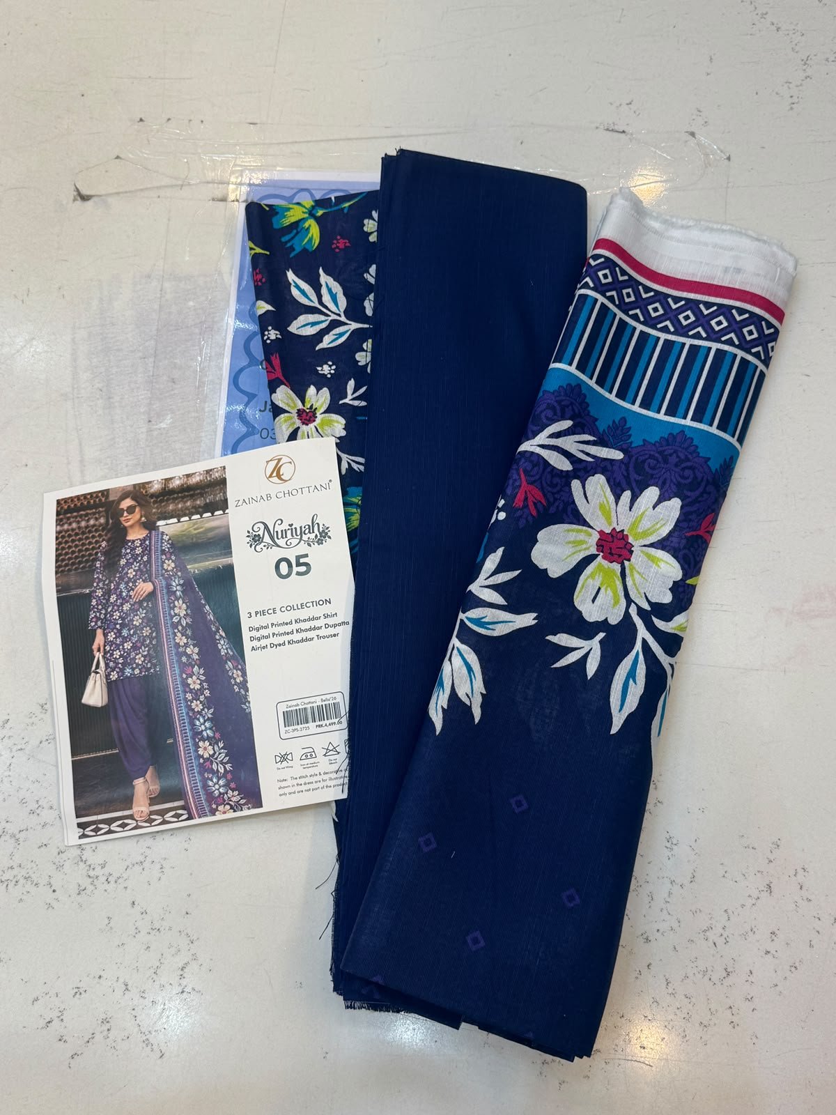 WhatsApp Image 2026-10-14 at 2.27.37 PM Zainab Chottani Nuriyah Collection 05 – Navy Blue Floral Printed Khaddar 3-Piece Suit - Image 1