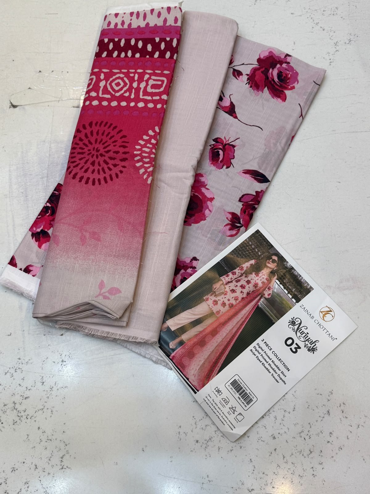WhatsApp Image 2026-10-14 at 2.27.38 PM (3) Zainab Chottani Nuriyah Collection 03 – Pink Floral Printed Khaddar 3-Piece Suit - Image 1