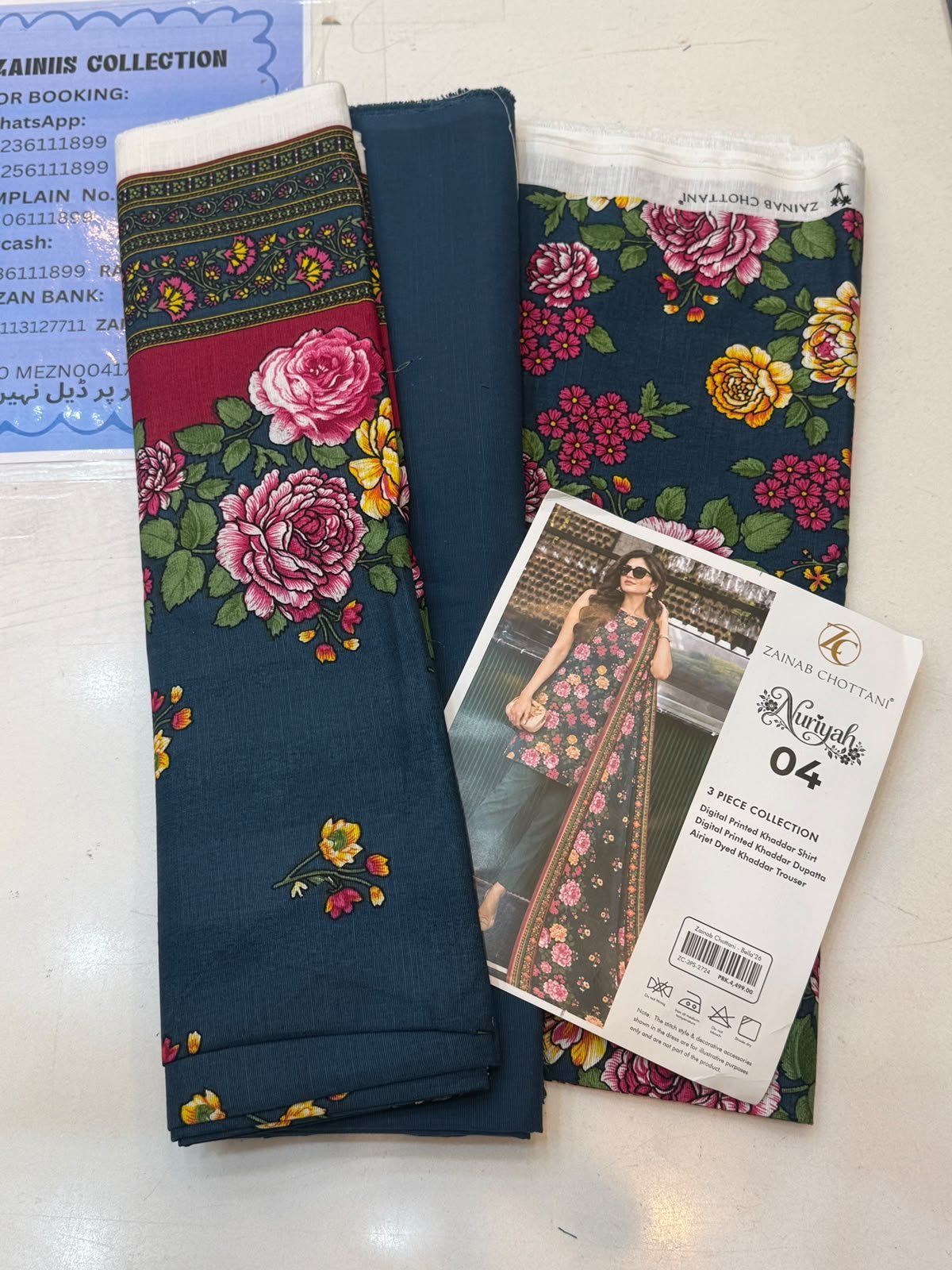 WhatsApp Image 2026-10-14 at 2.27.38 PM Zainab Chottani Nuriyah Collection 04 – Teal Blue Floral Printed Khaddar 3-Piece Suit - Image 1