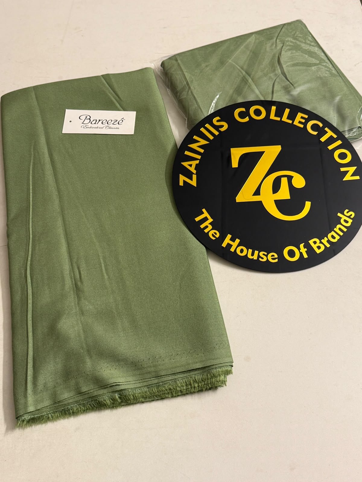 WhatsApp Image 2026-10-16 at 4.56.16 PM Bareeza Plain Karandi Fabric – Olive Green - Image 1